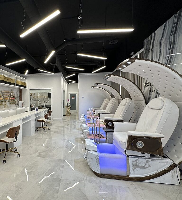 FH NAILS & More salon interior with pedicure chairs and manicure stations.